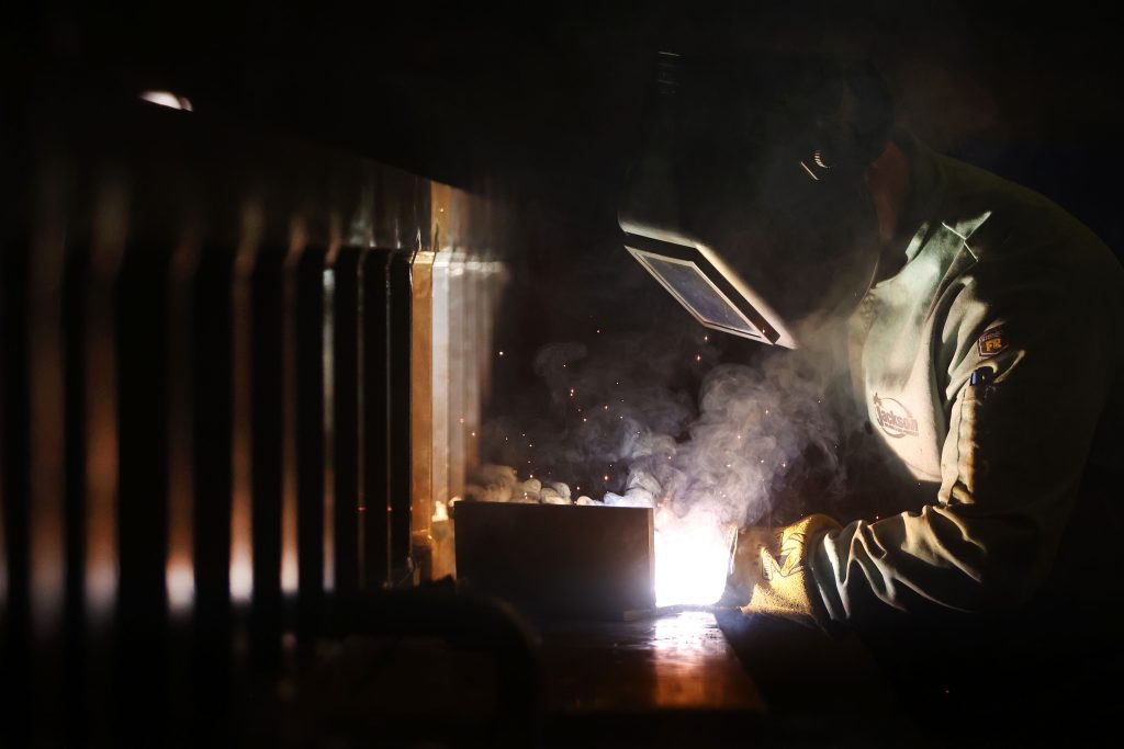 Serhii Zameniahre works on a welding project at Linita Design & Manufacturing in Buffalo on Tuesday, March 12, 2024. (Photo by Mark Mulville)